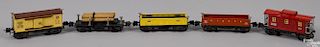 Five Lionel O Gauge freight train cars, to include a no. 3651 log carrier, a no. 3652 gondola