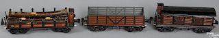 Three Marklin O Gauge freight train cars, to include a no. 18520 stake back log carrier