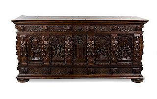 A Renaissance Style Carved Oak Casonne, Height 40 x width 82 x depth 30 inches.