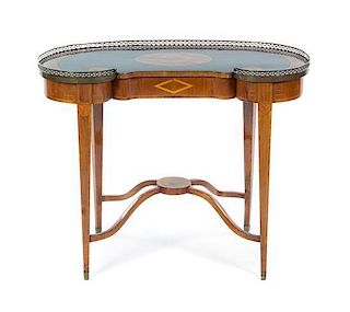A Continental Parcel Ebonized Writing Table, 19TH CENTURY, Height 29 x width 36 3/4 x depth 16 1/2 inches.