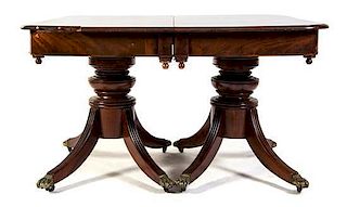An American Mahogany Double-Pedestal Dining Table, Height 31 1/2 x width 50 x depth 51 inches.