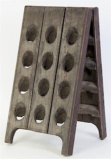 A French Wine Riddling Rack, Height 27 inches.