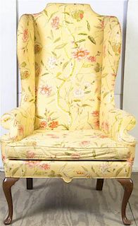 * A Queen Anne Wingback Armchair, Height 50 1/2 inches.