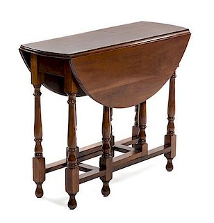 * An English Walnut Gate-Leg Table, Height 29 x width 36 x depth 13 1/2 inches (closed).