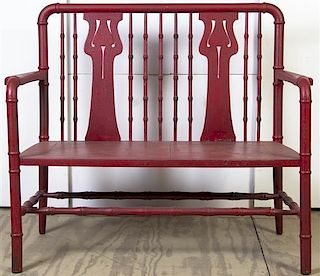 A Red Painted Wood Bench. Height 36 x width 43 x depth 19 1/8 inches.