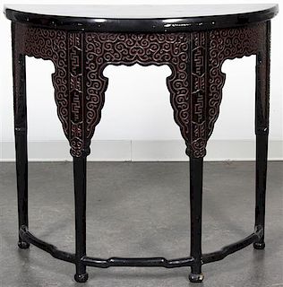 A Black Lacquered Console Table. Height 33 1/2 x width 33 1/2 x depth 14 inches.