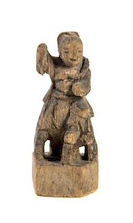 A Chinese Carved Wood Figure. Height 8 1/2 inches.