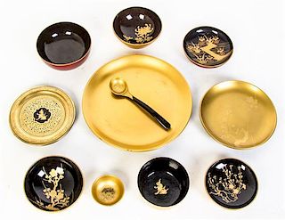 An Assembled Lacquerware Dinner Service, Diameter of plates 9 5/8 inches.