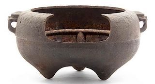 A Japanese Iron Vessel, Width over handles 15 inches.