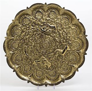 * An Indian Gilt Metal Tray, Diameter 19 inches.