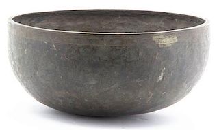 A Tibetan Hammered Bronze Singing Bowl, Diameter 11 1/2 inches.