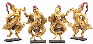 Four Thai Painted and Parcel Gilt Figures, Height 21 1/4 inches.