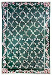 A Continental Needlepoint Carpet, 23 feet 4 inches x 11 feet 10 inches.