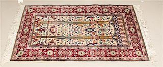 * A Persian Wool Prayer Rug 4 feet x 2 feet 7 inches.