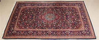 * An Isfahan Wool Rug 6 feet 10 inches x 4 feet 3 inches.
