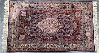 * A Persian Wool Rug 6 feet 11 inches x 4 feet 8 inches.