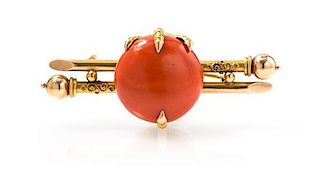 An Antique 18 Karat Yellow Gold and Coral Brooch, 9.80 dwts.