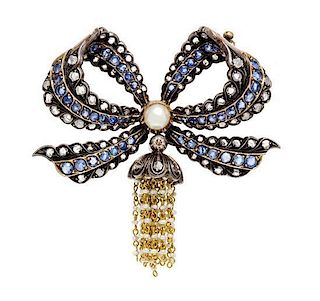 An Antique Silver Topped Yellow Gold, Diamond, Sapphire and Pearl Bow Brooch, 14.00 dwts.