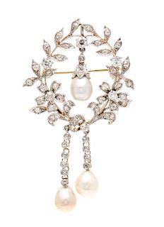 * An Edwardian Platinum Topped Yellow Gold, Natural Baroque Pearl and Diamond Pendant/Brooch, 10.90 dwts.