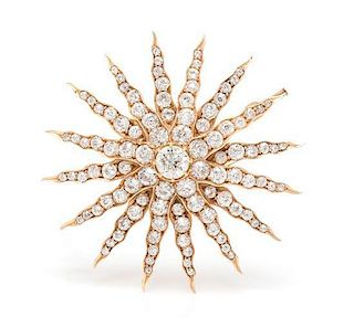 A Yellow Gold and Diamond Starburst Pendant/Brooch, 9.00 dwts.