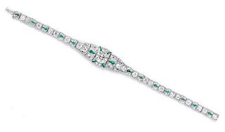 * An Art Deco Platinum, Diamond and Emerald Bracelet, 15.70 dwts.