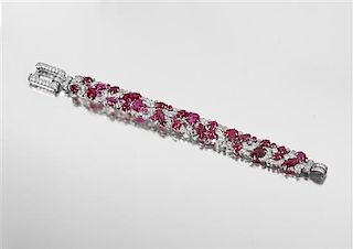 An Fine Art Deco Platinum, Diamond and Carved Ruby Bracelet, 30.80 dwts.