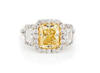 A Platinum, Yellow Gold, Fancy Intense Yellow Diamond and Diamond Ring, 5.20 dwts.
