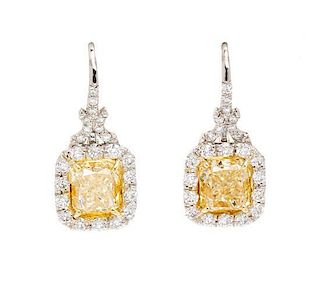 A Pair of Platinum, Yellow Gold, Fancy Intense Yellow Diamond and Diamond Earrings, 4.20 dwts.