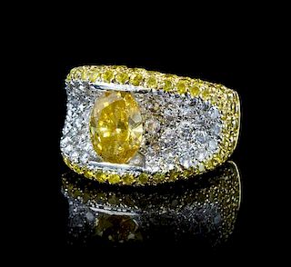 A 19 Karat Gold, Fancy Color Diamond and Diamond Ring, 11.00 dwts.