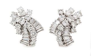A Pair of Platinum and Diamond Cluster Earclips, 15.00 dwts.