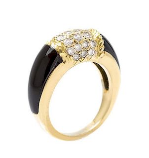 * An 18 Karat Yellow Gold, Onyx, and Diamond Ring 4.20 dwts.