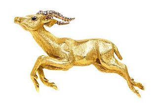 An 18 Karat Gold and Sapphire Antelope Brooch, Tiffany & Co., 12.40 dwts.