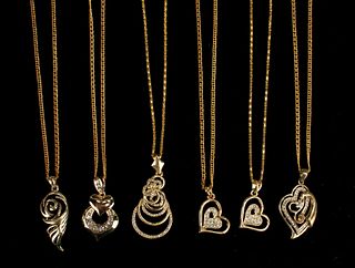 6 GOLD TONED PENDANTS ON CHAINS