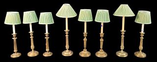 Four Pairs of Brass Candlesticks