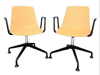 A Pair of Dietiker Swivel Chairs