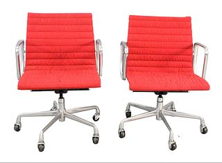 Two Red Eames Aluminum Group Chairs