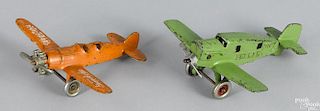 Two cast iron airplanes, to include a Hubley Bremen with a nickel-plated propeller and wheels