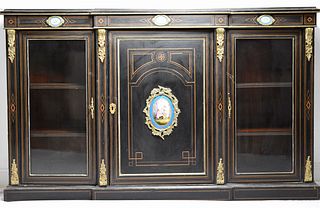 A Napoleon III Ebonised and brass-inlaid breakfront side cabinet.