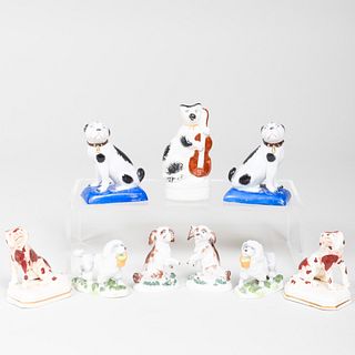 Group of Eight English Porcelain Models of Dogs