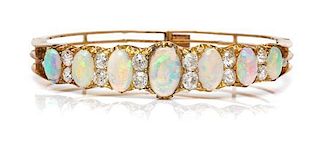 A Victorian Yellow Gold, Opal and Diamond Bangle Bracelet, 13.90 dwts.