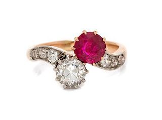 An Edwardian Platinum Topped Gold, Ruby and Diamond Toi et Moi Ring, 4.40 dwts.