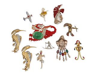 A group of vintage figurative costume jewelry