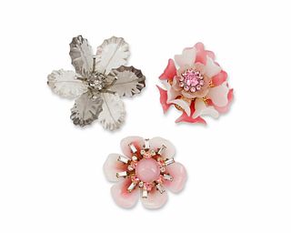 A group of floral brooches