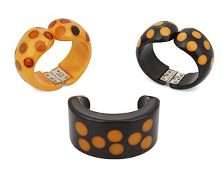 Three Bakelite dot cuff bracelets