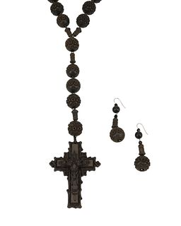 A carved wood rosary necklace and matching earrings