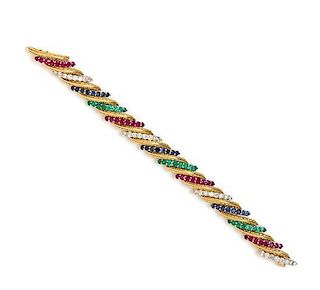 A Bicolor Gold, Diamond, Ruby, Sapphire and Emerald Bracelet, 31.00 dwts.