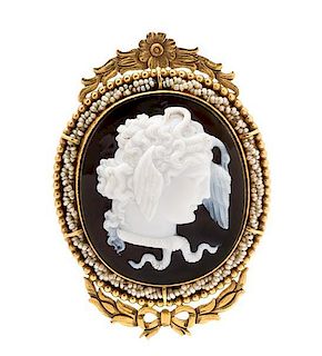 A Victorian Yellow Gold, Carved Onyx Cameo and Seed Pearl Brooch, 16.50 dwts.