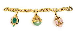 An 18 Karat Yellow Gold Charm Bracelet with Three Gold and Gem Pendant Charms, 74.30 dwts.