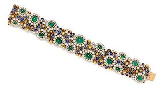 A Platinum, Yellow Gold, Diamond, Emerald and Sapphire Bracelet, 17.30 dwts.