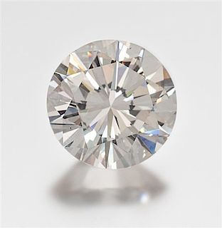 * A 7.99 Carat Round Brilliant Cut Diamond, 5.90 dwts.